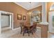 Formal dining room with dark walls, light floors, chandelier and large window with natural lighting at 39335 Harbor Hills Blvd, Lady Lake, FL 32159