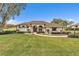 One-story house with walkway, lush landscaping, and a paved driveway at 39335 Harbor Hills Blvd, Lady Lake, FL 32159