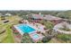 Community pool with lounge chairs and spa at 39335 Harbor Hills Blvd, Lady Lake, FL 32159