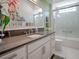 Modern bathroom with a vanity and glass-enclosed shower at 4038 Swaying Palm Ct, The Villages, FL 32163