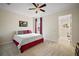 Bright bedroom with two twin beds and en-suite bathroom at 4038 Swaying Palm Ct, The Villages, FL 32163