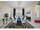 Elegant dining room features a glass table and stylish rug at 4038 Swaying Palm Ct, The Villages, FL 32163