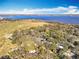 Aerial view of waterfront property and neighborhood at 405 Mission Ln, Howey In The Hills, FL 34737