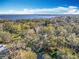 Aerial view of property and surrounding area, showing waterfront access at 405 Mission Ln, Howey In The Hills, FL 34737