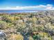 Aerial view of property and lakefront community at 405 Mission Ln, Howey In The Hills, FL 34737