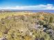 Aerial view of homes and landscape with water views at 405 Mission Ln, Howey In The Hills, FL 34737