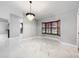 Bright dining room with marble floors and bay window at 405 Mission Ln, Howey In The Hills, FL 34737