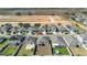 Aerial view of houses with solar panels and a truck at 417 Pinecrest Loop, Davenport, FL 33837