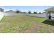 Large backyard with a grassy area and white fence at 417 Pinecrest Loop, Davenport, FL 33837