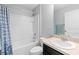 Clean bathroom with single vanity and shower/tub combo at 417 Pinecrest Loop, Davenport, FL 33837