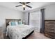 Cozy bedroom with a queen-size bed and ample closet space at 417 Pinecrest Loop, Davenport, FL 33837