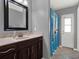 Bathroom with single vanity and shower/tub combo at 4520 Abaco Dr, Tavares, FL 32778