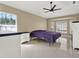 Spacious bedroom with a ceiling fan and large windows at 4520 Abaco Dr, Tavares, FL 32778