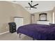 Main bedroom with ceiling fan and plenty of dresser space at 4520 Abaco Dr, Tavares, FL 32778