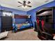 Fun bedroom with a bunk bed and a gaming chair at 4520 Abaco Dr, Tavares, FL 32778