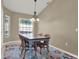 Charming dining room with table, chairs, and stylish light fixture at 4520 Abaco Dr, Tavares, FL 32778