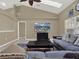 Bright living room with vaulted ceilings, comfy seating and large TV at 4520 Abaco Dr, Tavares, FL 32778