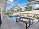 Inviting screened pool area with patio furniture at 4520 Abaco Dr, Tavares, FL 32778