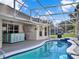 Inviting pool with a screened enclosure at 4520 Abaco Dr, Tavares, FL 32778