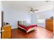 Bedroom with a full bed, wood floors, and ceiling fan at 453 Hildalgo Dr, Lady Lake, FL 32159