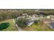 Aerial view showcasing the community and golf course at 4557 Antietam Creek Trl, Leesburg, FL 34748