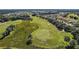 Aerial view of a golf course and residential area at 4557 Antietam Creek Trl, Leesburg, FL 34748