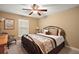 Relaxing bedroom with king-size bed and plantation shutters at 4557 Antietam Creek Trl, Leesburg, FL 34748