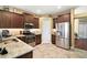 Kitchen features stainless steel appliances and ample cabinetry at 4557 Antietam Creek Trl, Leesburg, FL 34748