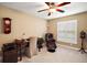 Home office with a comfortable chair and large window at 4557 Antietam Creek Trl, Leesburg, FL 34748