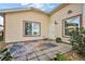 Back patio with outdoor seating and a tranquil garden view at 4822 Sawgrass Lake Cir, Leesburg, FL 34748