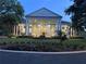 Stately home featuring grand columns, elegant landscaping, and a welcoming entrance, perfect for luxurious living at 4822 Sawgrass Lake Cir, Leesburg, FL 34748