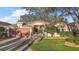 Charming single-story home with a well-manicured lawn, a picket fence, and a two-car garage at 4822 Sawgrass Lake Cir, Leesburg, FL 34748