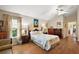 A spacious main bedroom with a large windows and comfortable flooring at 4822 Sawgrass Lake Cir, Leesburg, FL 34748