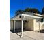 White carport provides covered parking at 505 W 10Th Ave, Mount Dora, FL 32757