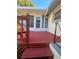 Spacious red deck with access to house and yard at 505 W 10Th Ave, Mount Dora, FL 32757