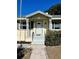 House exterior featuring a light blue front door at 505 W 10Th Ave, Mount Dora, FL 32757