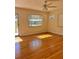 Living room with hardwood floors and lots of sunlight at 505 W 10Th Ave, Mount Dora, FL 32757