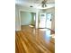 Bright living room with hardwood floors and ceiling fan at 505 W 10Th Ave, Mount Dora, FL 32757