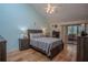 Main bedroom with private access to a patio at 601 Waterwood Dr, Yalaha, FL 34797