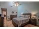 Main bedroom with wood floors and ample light at 601 Waterwood Dr, Yalaha, FL 34797