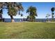 Scenic waterfront dock with gazebo and seating area at 601 Waterwood Dr, Yalaha, FL 34797