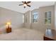 Bedroom with window shutters and ceiling fan at 6319 Berkshire Pass, Leesburg, FL 34748