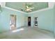 Spacious bedroom with access to bathroom and backyard at 6319 Berkshire Pass, Leesburg, FL 34748