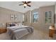 Main bedroom with large windows and ceiling fan at 6319 Berkshire Pass, Leesburg, FL 34748