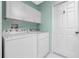 Laundry room with washer, dryer and cabinets at 6319 Berkshire Pass, Leesburg, FL 34748