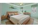 Bright main bedroom with light walls and a neutral color scheme at 6319 Berkshire Pass, Leesburg, FL 34748