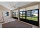 Relaxing sunroom with lake view and window shades at 6319 Berkshire Pass, Leesburg, FL 34748