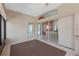 Spacious sunroom featuring sliding glass doors and tiled flooring at 6319 Berkshire Pass, Leesburg, FL 34748