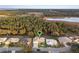 Aerial view showcasing property location near a lake at 6525 Borg St, Leesburg, FL 34748