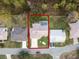 Aerial view of a house with a pool in a residential area at 6525 Borg St, Leesburg, FL 34748